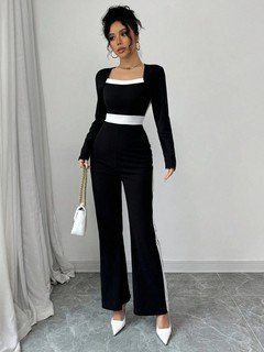 Full length front view of the black contrast-trim square-neck long-sleeve jumpsuit, showing the silhouette and fit.