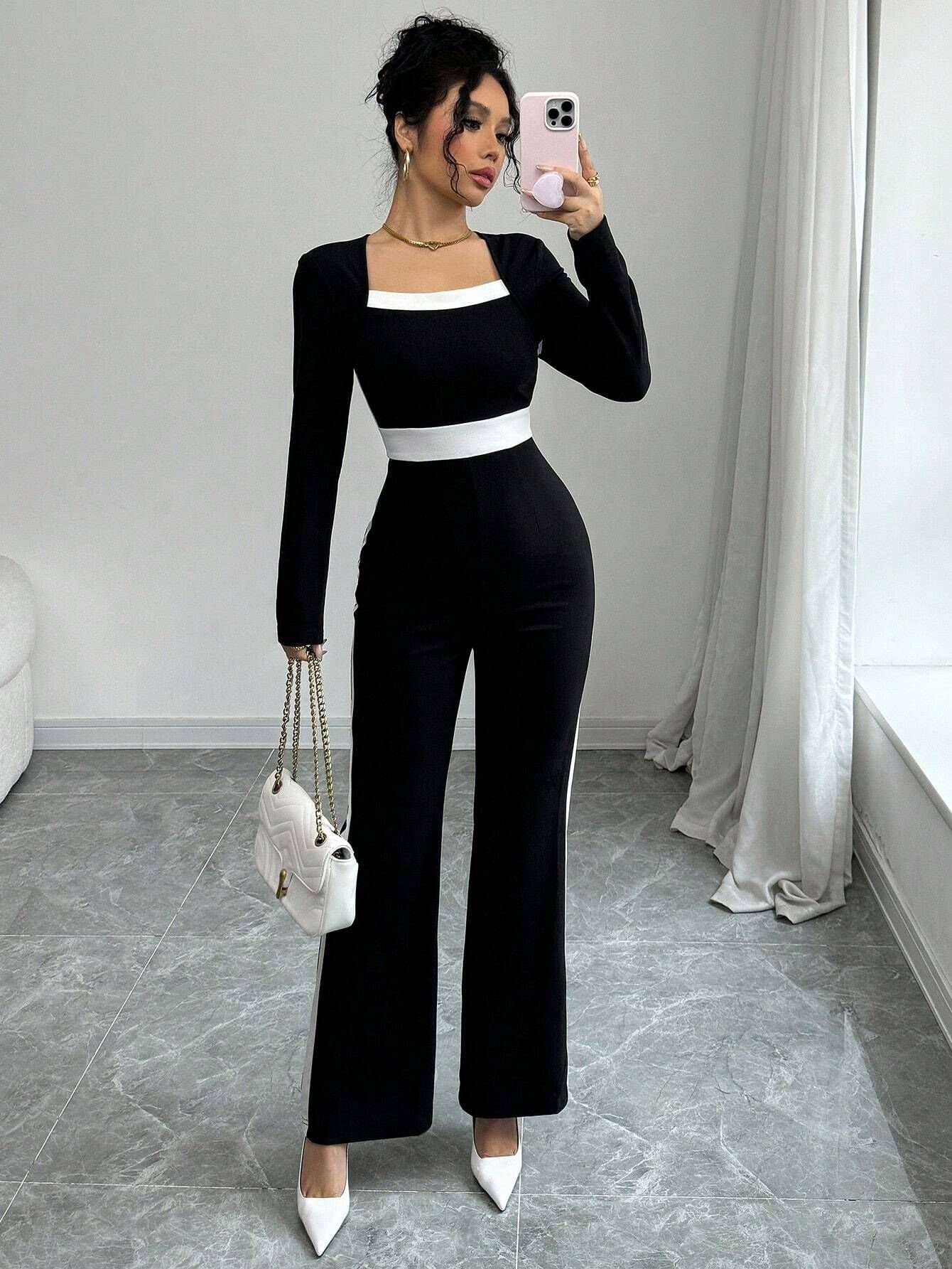 Black Contrast-Trim Square-Neck Long-Sleeve Jumpsuit – Front View Front view of the black contrast-trim square-neck long-sleeve jumpsuit, showing the silhouette and fit.