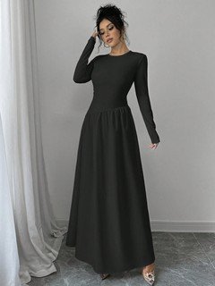 Angled front view of the black long-sleeve fit-and-flare maxi dress, showing its silhouette and design details.