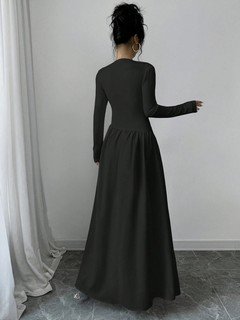 Back view of the black long-sleeve fit-and-flare maxi dress, showing its silhouette and design details.