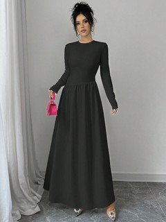 Styled front view of the black long-sleeve fit-and-flare maxi dress, showing its silhouette and design details.