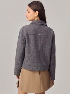 Back view of the gray cropped flap-pocket jacket, showing its silhouette and design details.