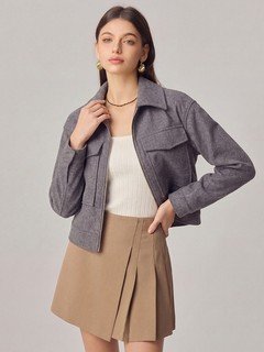 Styled front view of the gray cropped flap-pocket jacket, showing its silhouette and design details.