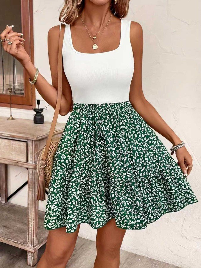 Front view of the green ditsy floral square-neck sleeveless a-line mini dress, showing the silhouette and fit.