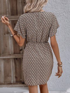 Back view of the brown ditsy print tie-waist wrap dress, showing its silhouette and design details.