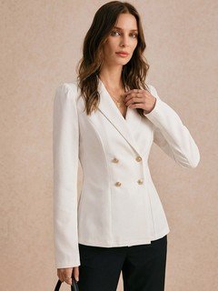 Angled front view of the ivory double-breasted shawl blazer, showing its silhouette and design details.