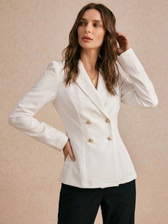 Styled front view of the ivory double-breasted shawl blazer, showing its silhouette and design details.