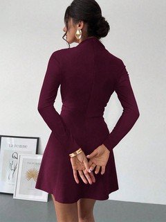 Back view of the burgundy draped mock-neck a-line dress, showing its silhouette and design details.