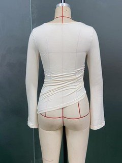 Mannequin back view of the ivory draped ruched asymmetric flared-sleeve top, showing the silhouette and fit.