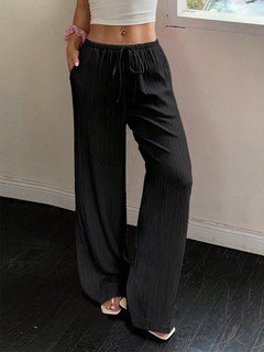 Full-length front view of the black drawstring wide-leg pants, showing its silhouette and design details.