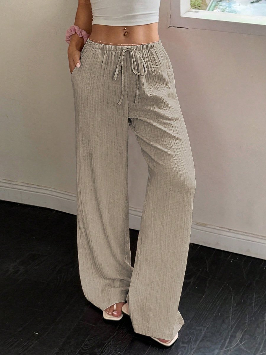 Beige Drawstring Wide-Leg Pants – Front View Front view of the beige drawstring wide-leg pants, showing its silhouette and design details.