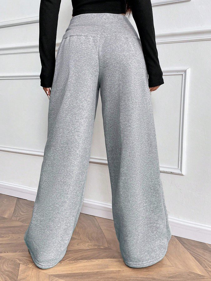 Back view of the gray drawstring-waist wide-leg sweatpants, showing the silhouette and fit.