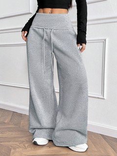 Angled back view of the gray drawstring-waist wide-leg sweatpants, showing the silhouette and fit.
