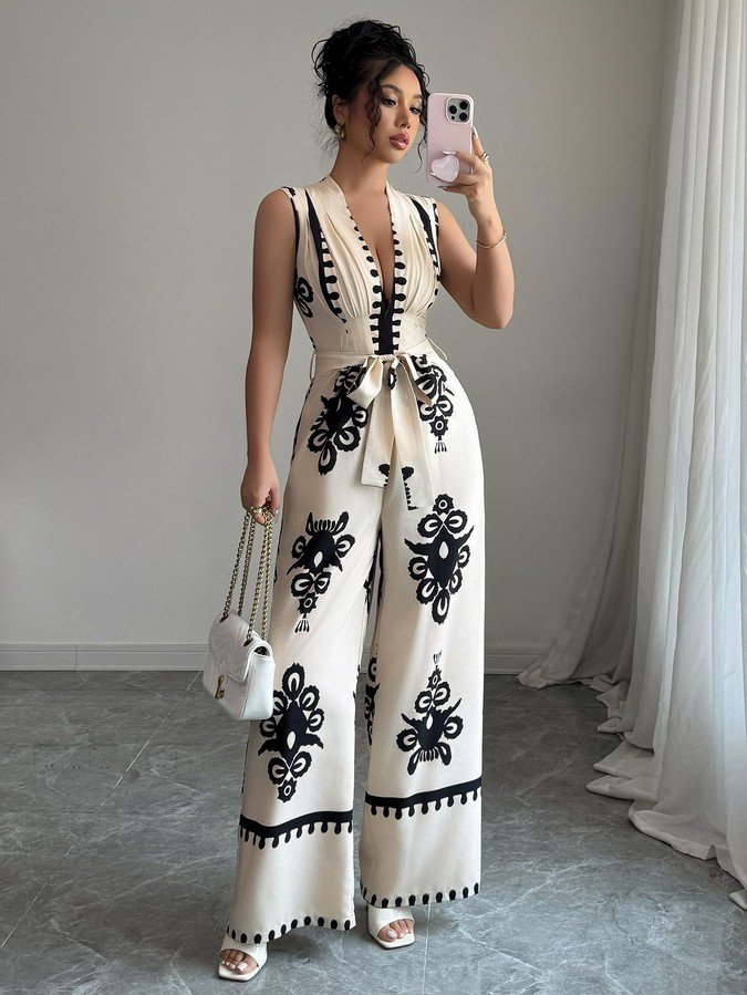 Alternate front view of the ivory embroidered deep-v belted wide-leg jumpsuit, showing the silhouette and fit.