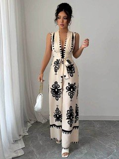 Styled front view of the ivory embroidered deep-v belted wide-leg jumpsuit, showing the silhouette and fit.
