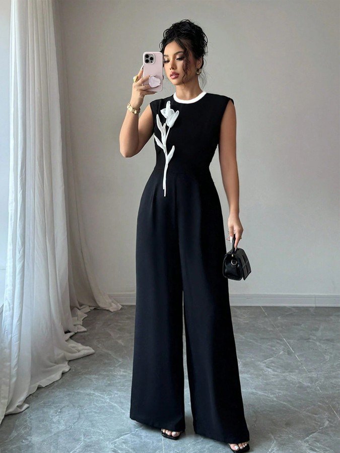 Front view of the black embroidered sleeveless wide-leg jumpsuit, showing the silhouette and fit.