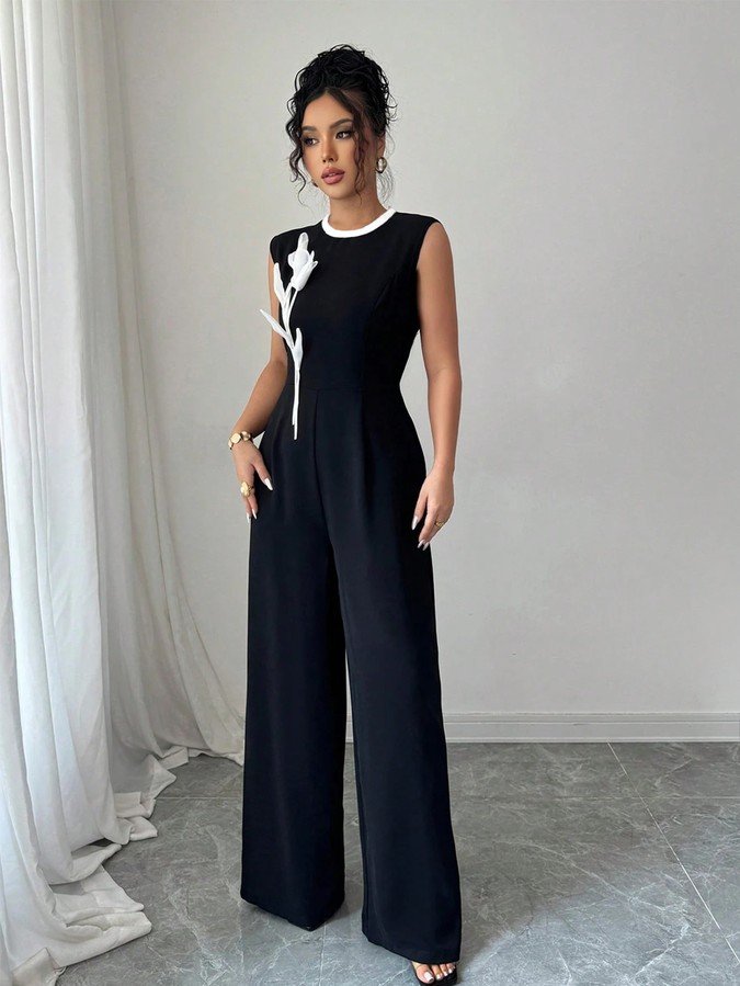 Full length front view of the black embroidered sleeveless wide-leg jumpsuit, showing the silhouette and fit.