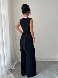 Back view of the black embroidered sleeveless wide-leg jumpsuit, showing the silhouette and fit.