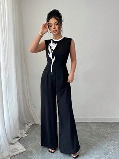 Styled front view of the black embroidered sleeveless wide-leg jumpsuit, showing the silhouette and fit.