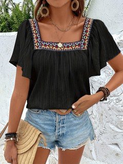 Full-length front view of the black embroidered square-neck blouse, showing its silhouette and design details.