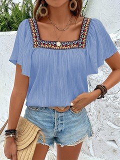 Full-length front view of the blue embroidered square-neck blouse, showing its silhouette and design details.