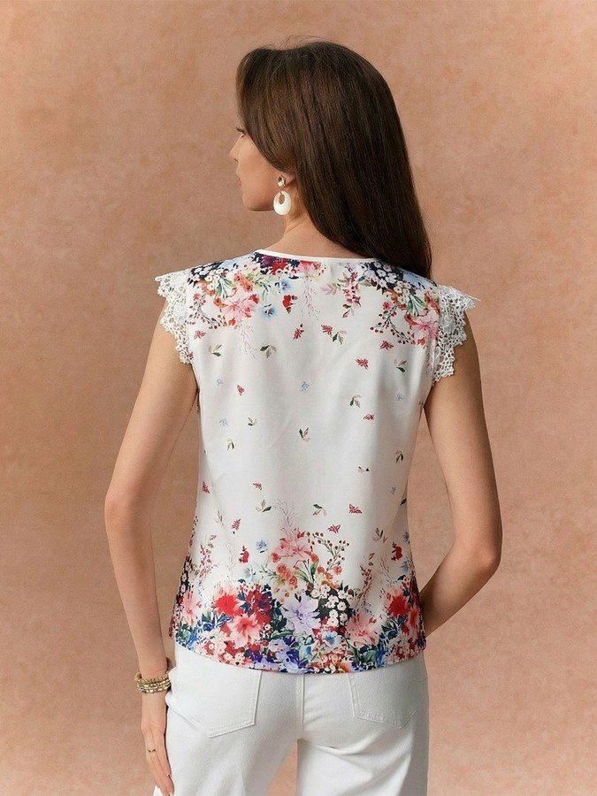 Back view of the white floral border sleeveless blouse, showing its silhouette and design details.