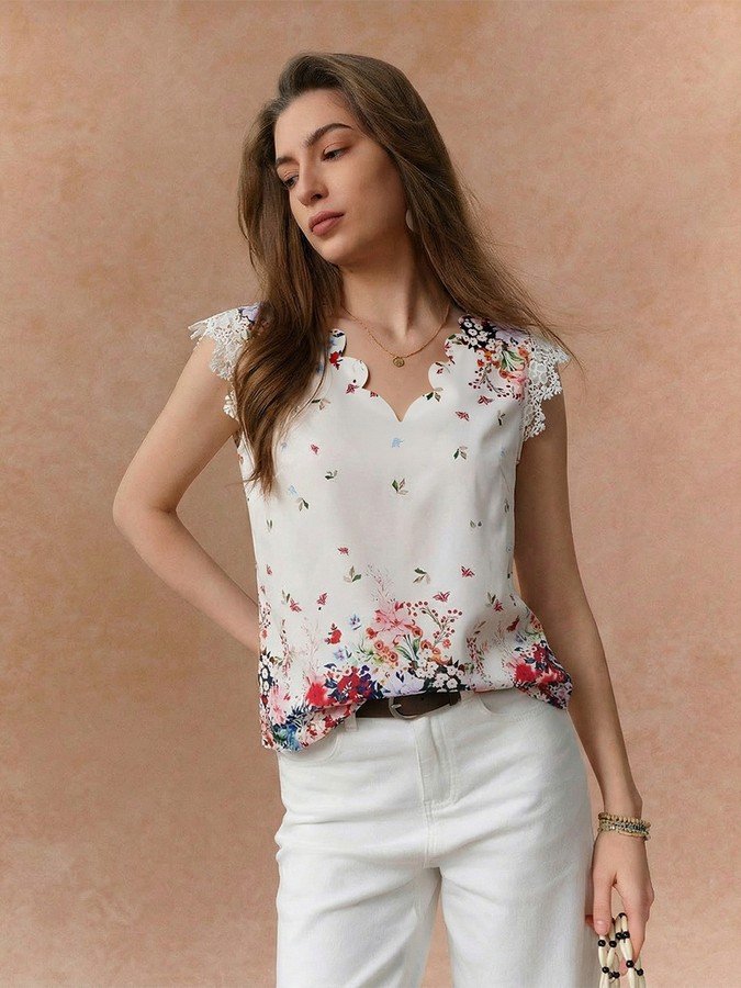Front view of the white floral border sleeveless blouse, showing its silhouette and design details.