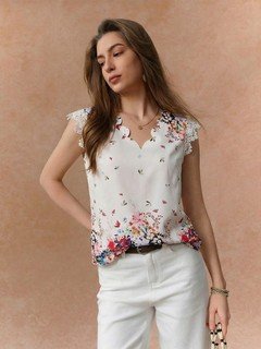 Front view of the white floral border sleeveless blouse, showing its silhouette and design details.