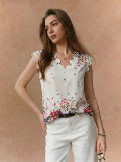 Styled front view of the white floral border sleeveless blouse, showing its silhouette and design details.