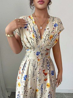 Close-up of the cream floral wrap-front jumpsuit, showing its silhouette and design details.