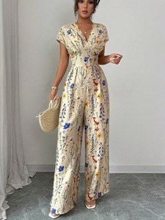 Full-length front view of the cream floral wrap-front jumpsuit, showing its silhouette and design details.