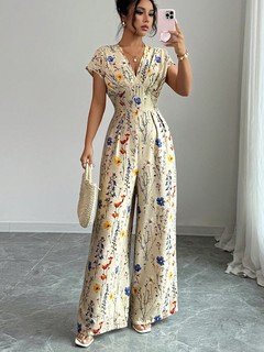 Styled front view of the cream floral wrap-front jumpsuit, showing its silhouette and design details.