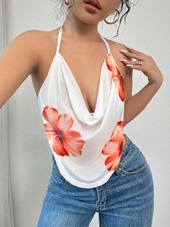Lifestyle front view of the white and orange floral cowl-neck halter top, showing its silhouette and design details.