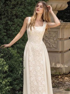 Model front view of the ivory floral-embossed square-neck sleeveless midi dress, showing the silhouette and fit.