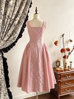 Mannequin back view of the pink floral-embossed square-neck sleeveless midi dress, showing the silhouette and fit.
