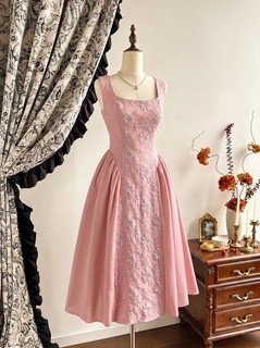Mannequin front view of the pink floral-embossed square-neck sleeveless midi dress, showing the silhouette and fit.