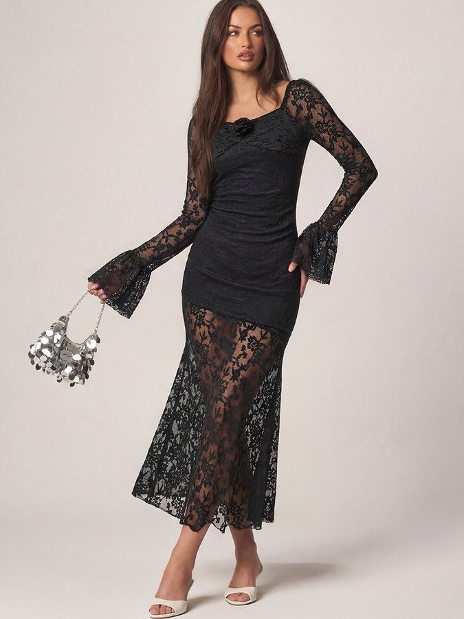 Angled front view of the black floral lace long-sleeve maxi dress, showing its silhouette and design details.