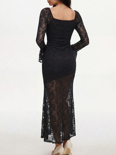 Back view of the black floral lace long-sleeve maxi dress, showing its silhouette and design details.