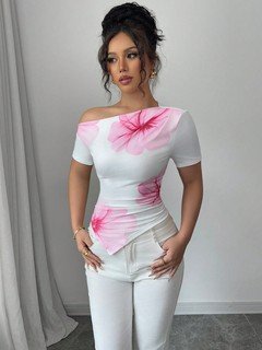 Lifestyle front view of the white and pink floral one-shoulder fitted top, showing its silhouette and design details.
