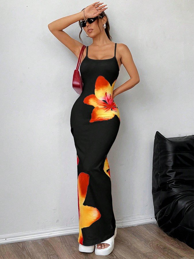Angled front view of the black and orange floral bodycon maxi slip dress, showing its silhouette and design details.