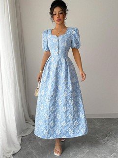 Angled front view of the blue floral puff-sleeve a-line dress, showing its silhouette and design details.