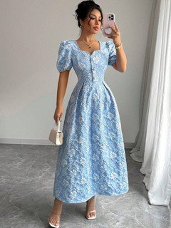Full-length front view of the blue floral puff-sleeve a-line dress, showing its silhouette and design details.