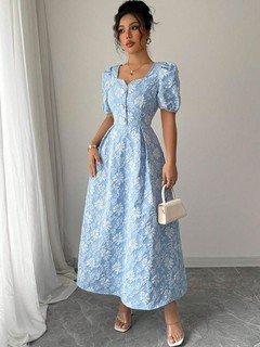 Lifestyle front view of the blue floral puff-sleeve a-line dress, showing its silhouette and design details.