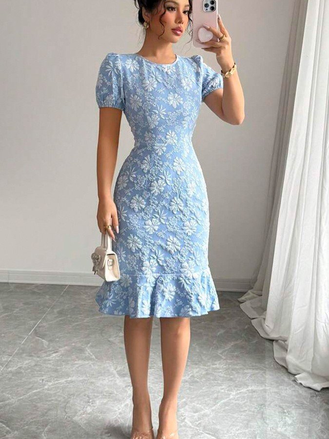Angled front view of the blue floral textured fishtail dress, showing its silhouette and design details.