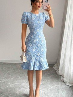 Angled front view of the blue floral textured fishtail dress, showing its silhouette and design details.