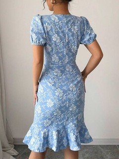 Back view of the blue floral textured fishtail dress, showing its silhouette and design details.