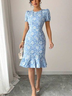 Lifestyle front view of the blue floral textured fishtail dress, showing its silhouette and design details.