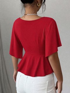 Back view of the red flutter-sleeve ruched-waist peplum blouse, showing the silhouette and fit.