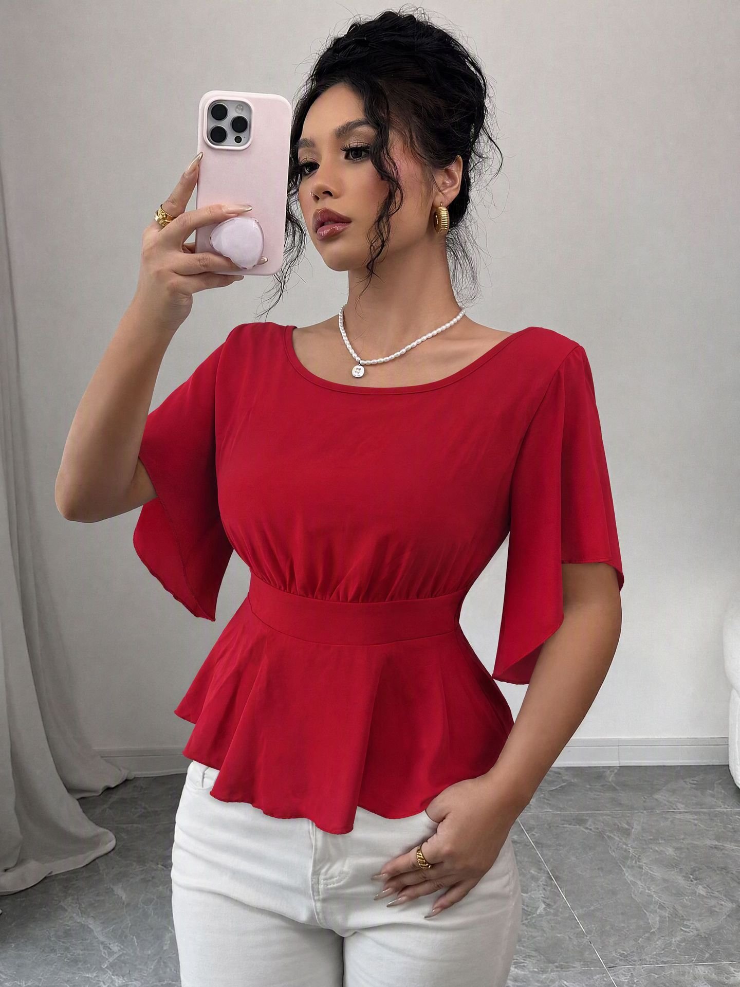 Red Flutter-Sleeve Ruched-Waist Peplum Blouse – Front View Front view of the red flutter-sleeve ruched-waist peplum blouse, showing the silhouette and fit.