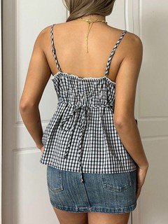 Back view of the black and white gingham twist-front camisole, showing its silhouette and design details.